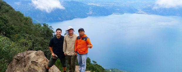 Guests and Tour Guide posing in front of Lake Atitlan